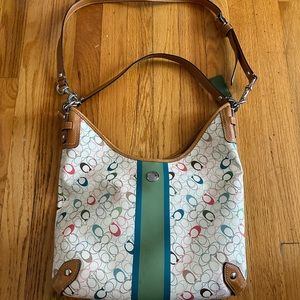 Coach shoulder bag with shoulder strap and handle